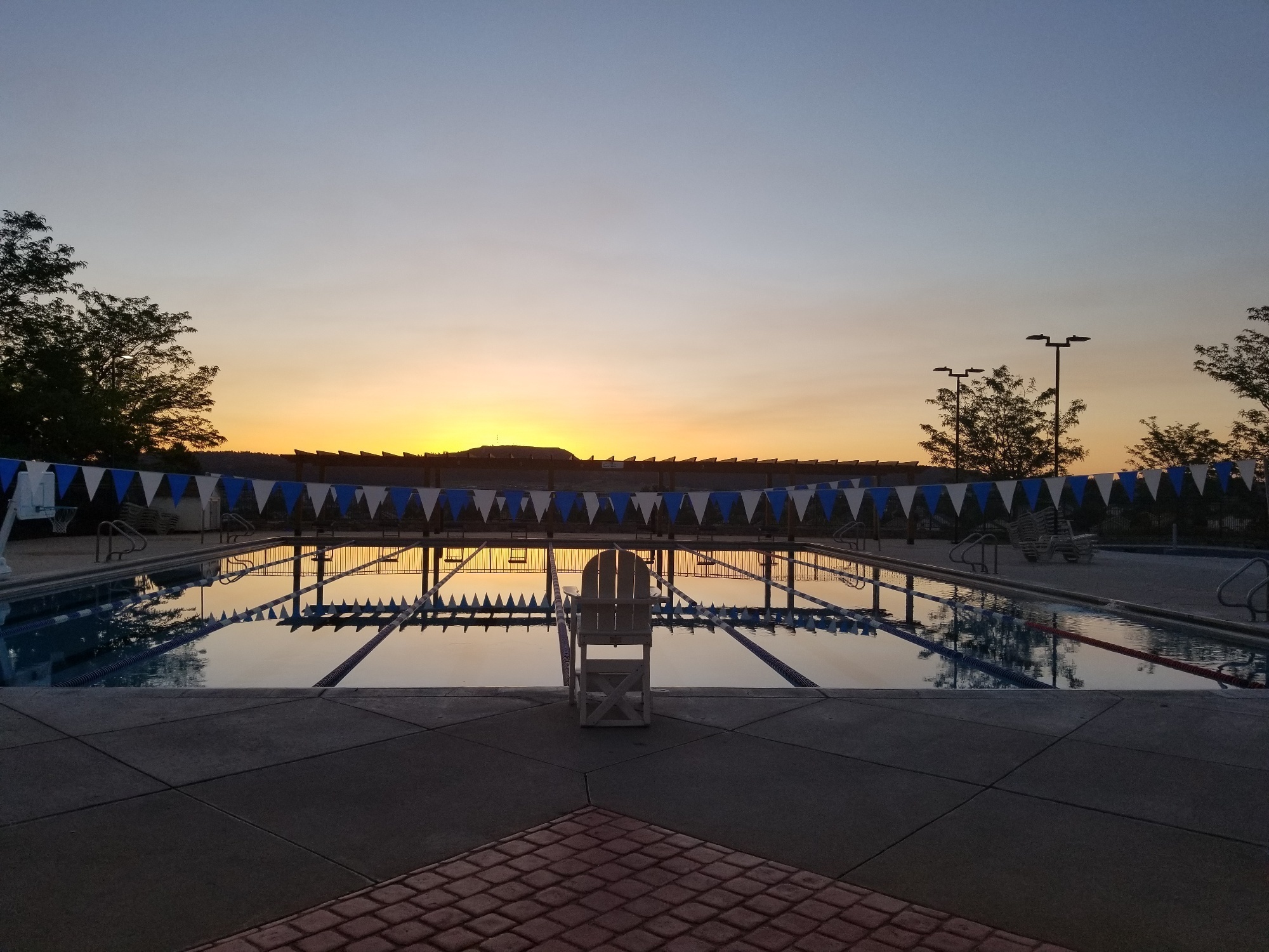 An empty Pool with lane lines in Castle Rock at Sunrise