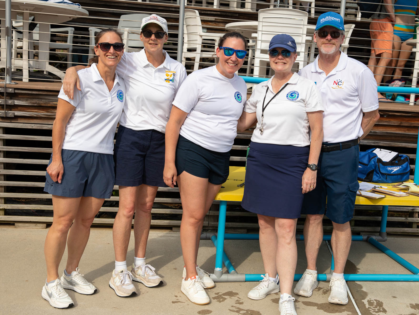 Photo shows a group of Overlee Officials at a swim meet