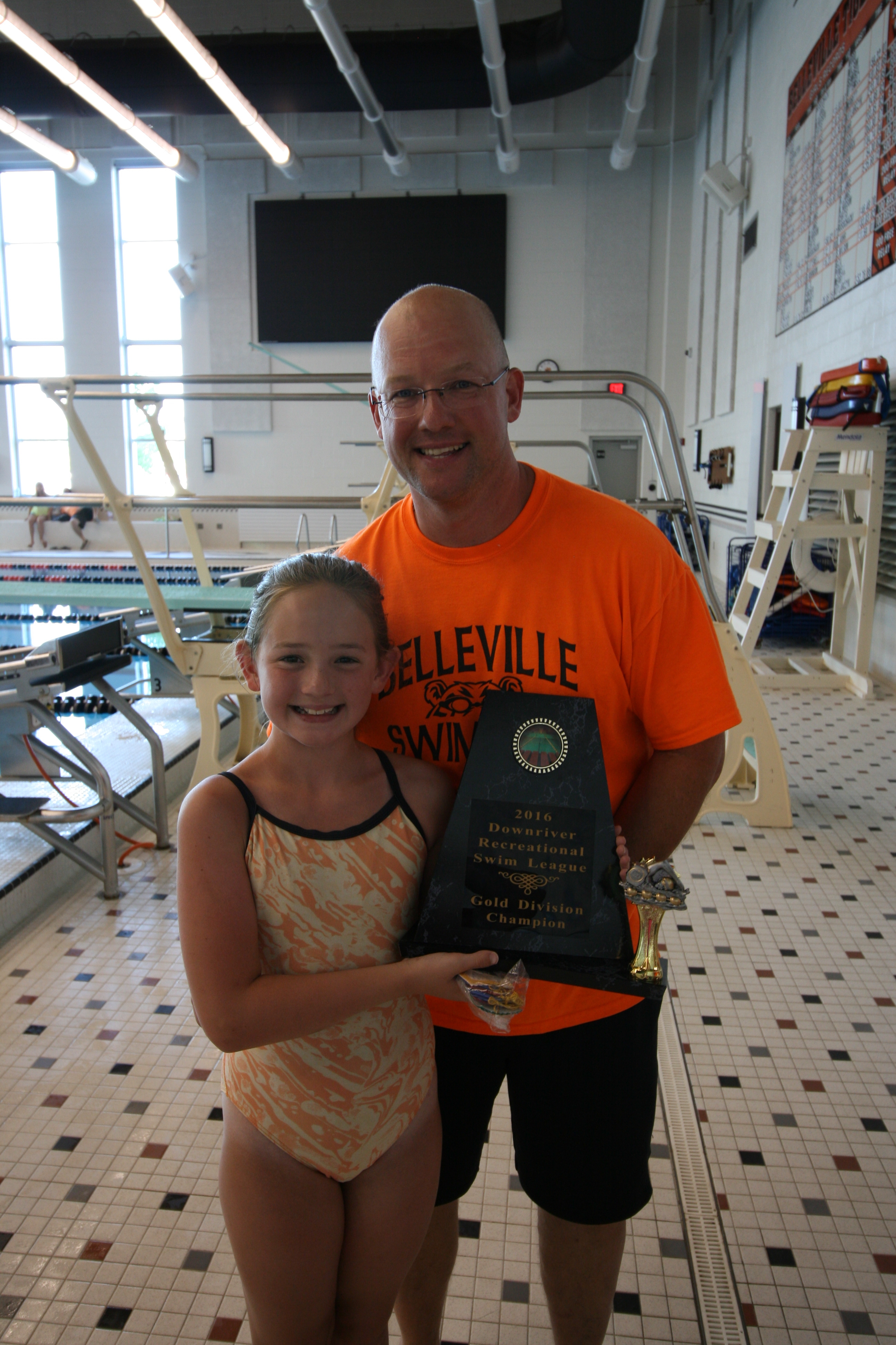 Coach and Swimmer with Trophy